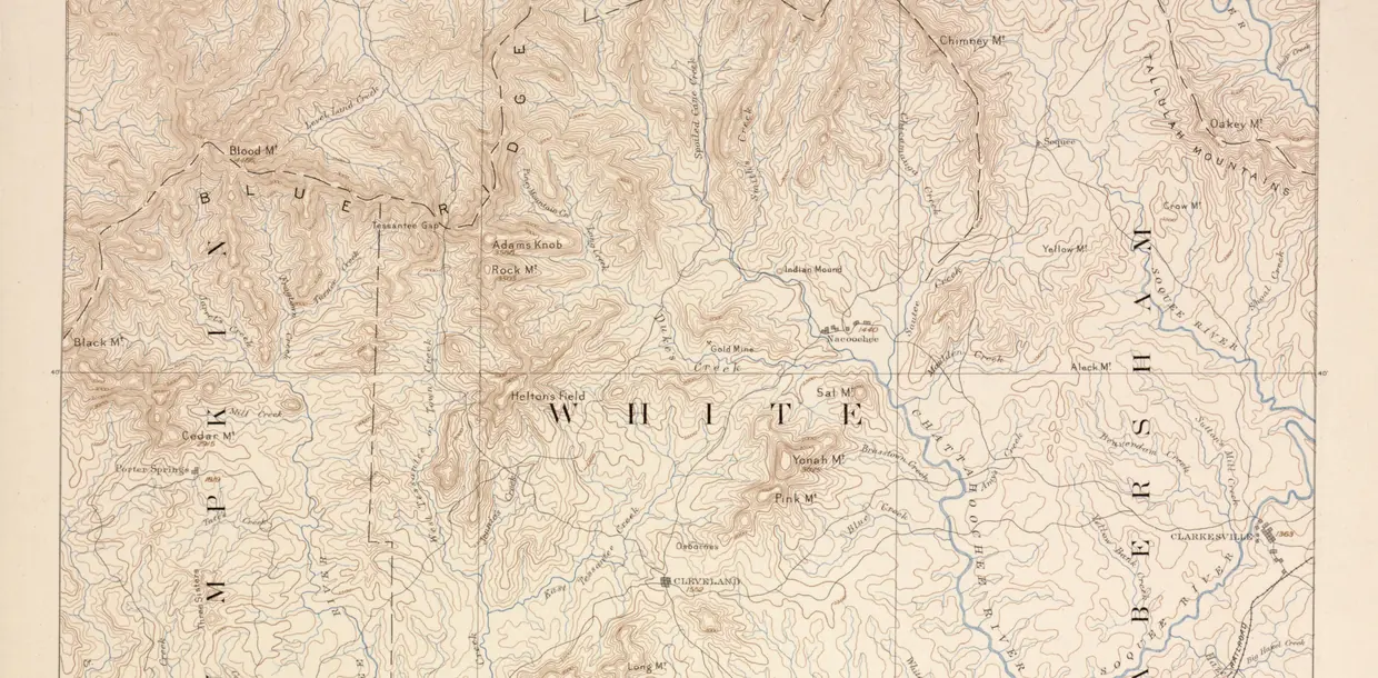 A hand-drawn topographic map in brown contour lines and blue streams, with Dahlonega, Findley Ridge and a winding river among ridges.
